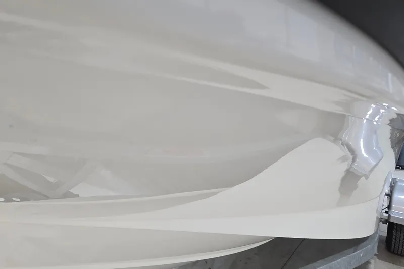 Slide: The Image of 2014 Boston Whaler 170 Montauk boat hull close-up, showcasing sleek design and glossy finish. - 21