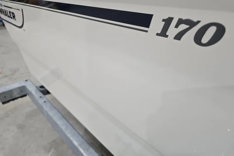 Slide: The Image of Close-up of 2014 Boston Whaler 170 Montauk boat hull with model number. - 23