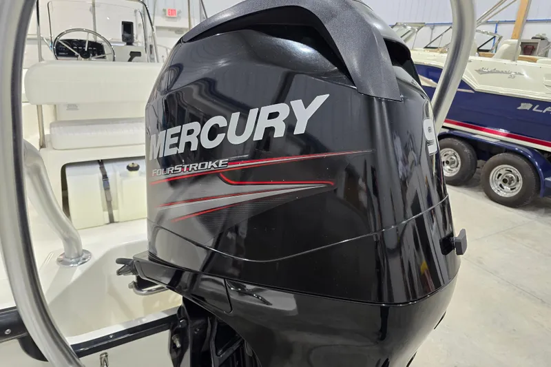 Slide: The Image of 2014 Boston Whaler 170 Montauk with Mercury FourStroke engine in a showroom. - 27