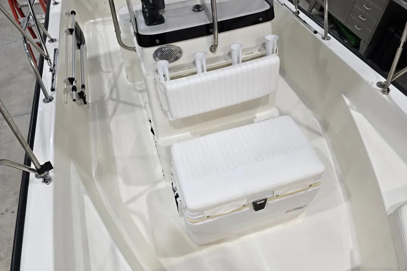 Slide: The Image of 2014 Boston Whaler 170 Montauk interior with white seating and rod holders. - 34