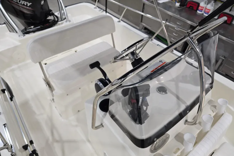 Slide: The Image of 2014 Boston Whaler 170 Montauk boat interior with steering console and seating. - 35