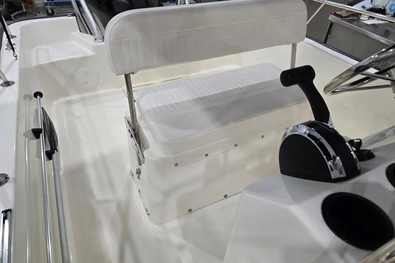 Slide: The Image of 2014 Boston Whaler 170 Montauk interior with steering wheel and seating. - 36