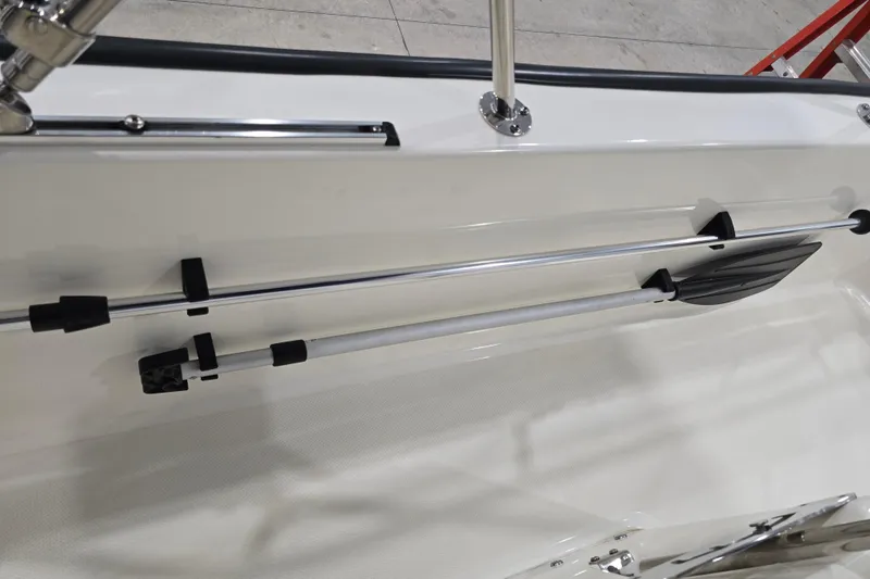Slide: The Image of 2014 Boston Whaler 170 Montauk boat interior with mounted paddle and railing. - 37