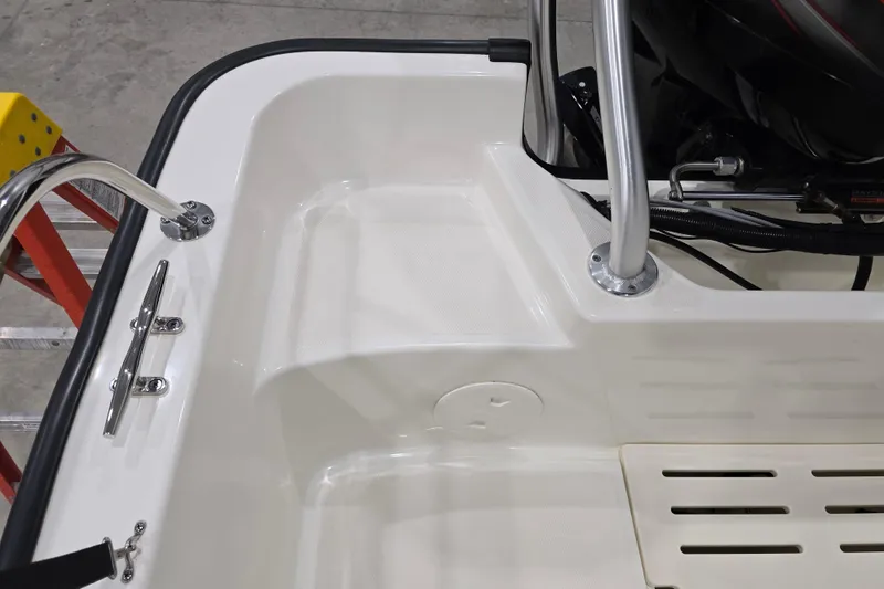Slide: The Image of 2014 Boston Whaler 170 Montauk boat interior with stainless steel fittings and non-slip surface. - 39