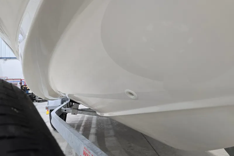 Slide: The Image of 2014 Boston Whaler 170 Montauk boat hull on trailer in garage. - 46