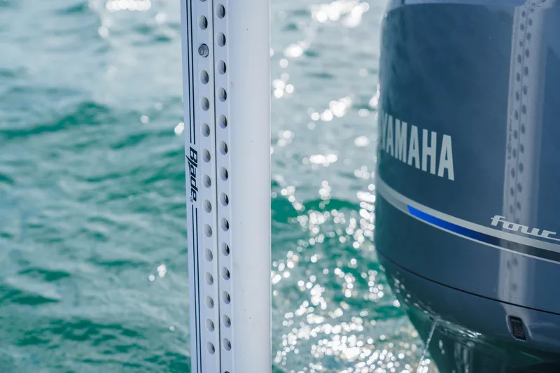 Slide: The Image of Yamaha outboard motor on 2022 Sea Hunt Ultra 219, with water in the background. - 16
