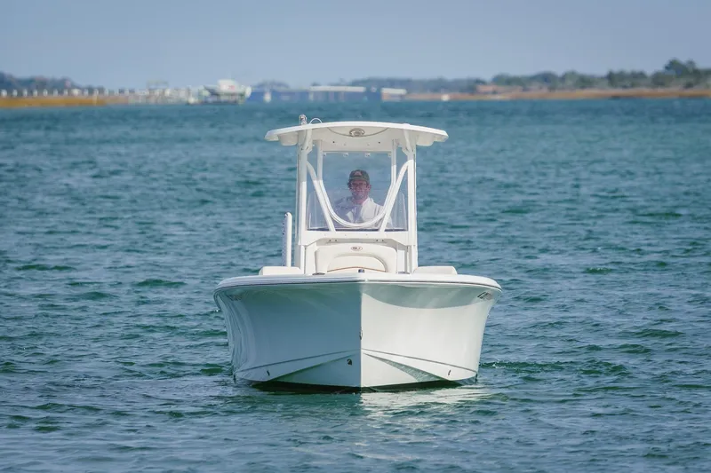 Slide: The Image of 2022 Sea Hunt Ultra 219 boat cruising on open water. - 7