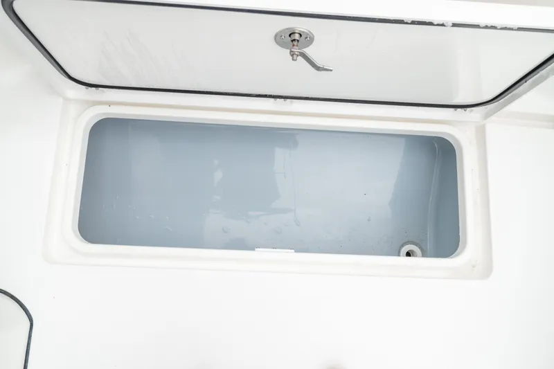 Slide: The Image of Open storage compartment on 2026 Crevalle 33 CSF boat. - 25