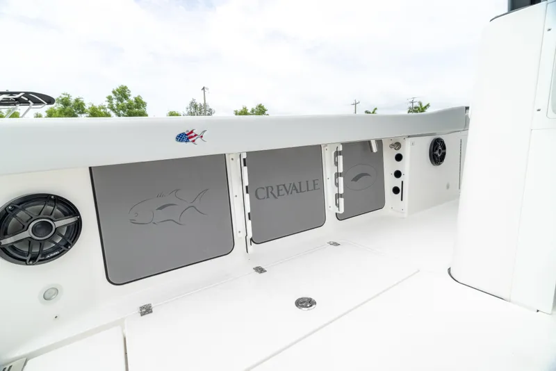 Slide: The Image of 2026 Crevalle 33 CSF boat interior with storage compartments and speaker. - 29