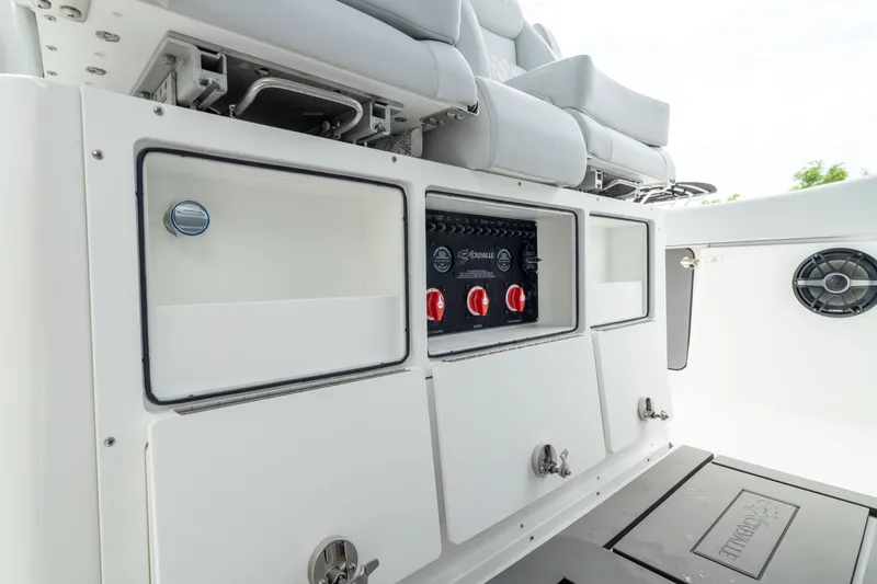 Slide: The Image of 2026 Crevalle 33 CSF boat interior with storage compartments and control panel. - 34