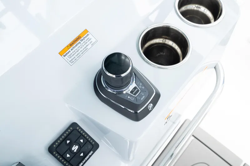 Slide: The Image of 2026 Crevalle 33 CSF boat console with controls and cup holders. - 42