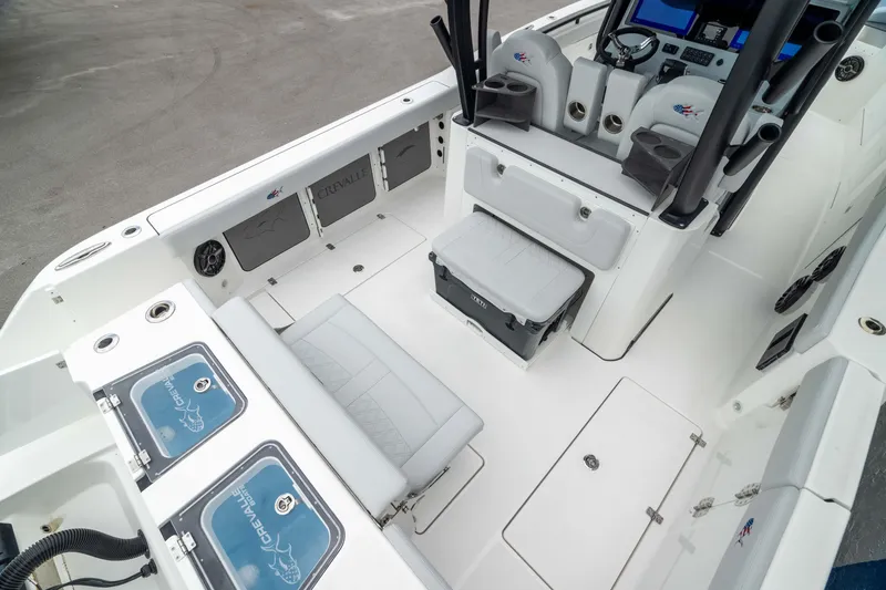 Slide: The Image of 2026 Crevalle 33 CSF boat interior with seating, storage, and control panel. - 7