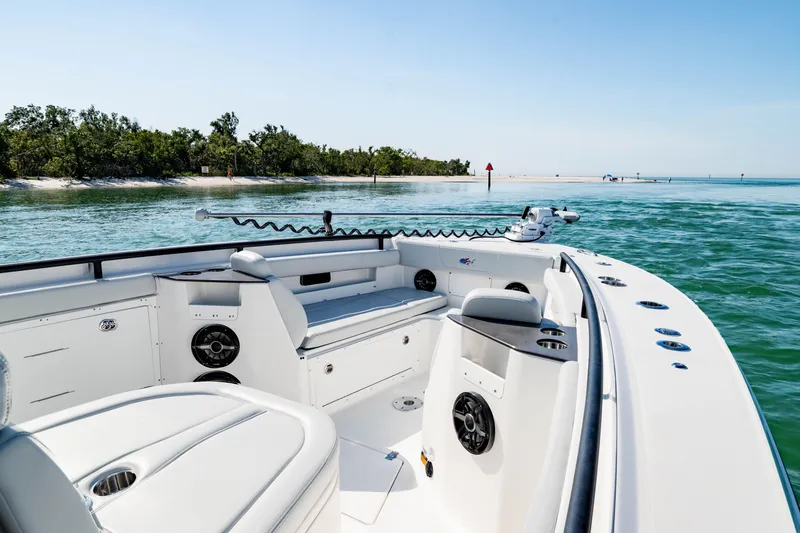 Slide: The Image of 2026 Crevalle 33 CSF boat interior with scenic coastal view. - 16
