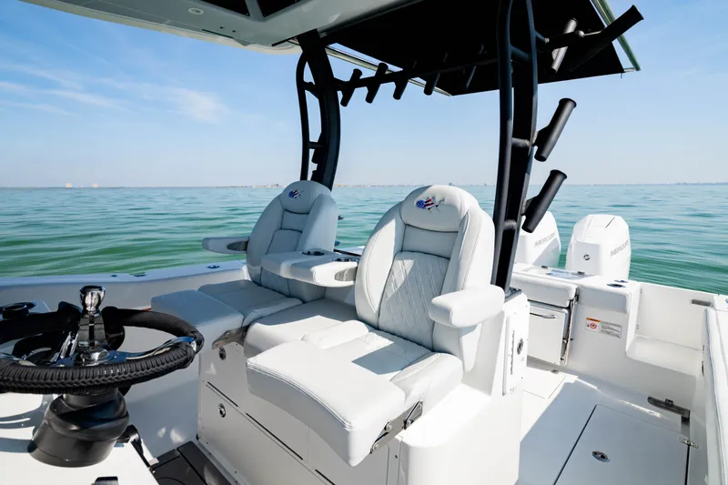 Slide: The Image of 2026 Crevalle 33 CSF boat interior with luxurious seating and ocean view. - 19