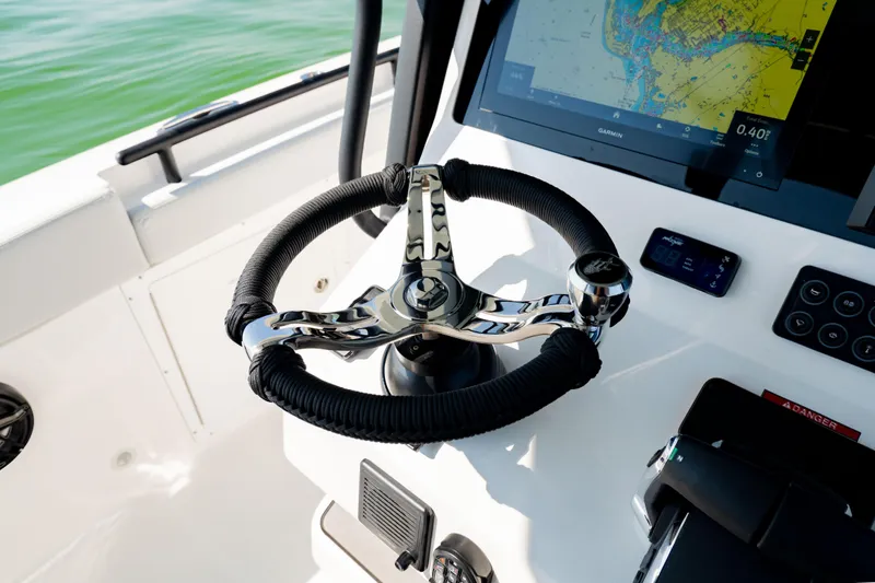 Slide: The Image of Steering wheel and navigation display on 2026 Crevalle 33 CSF boat. - 22