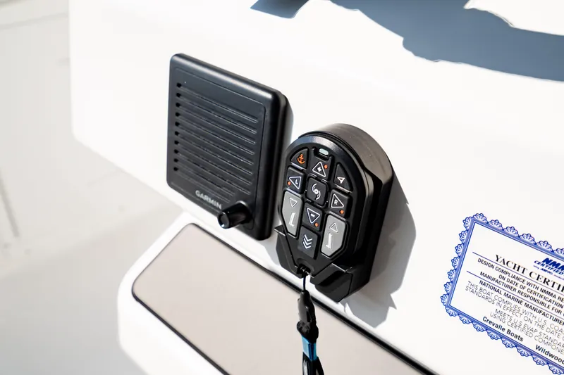 Slide: The Image of Control panel and speaker on 2026 Crevalle 33 CSF boat, featuring Garmin technology. - 24