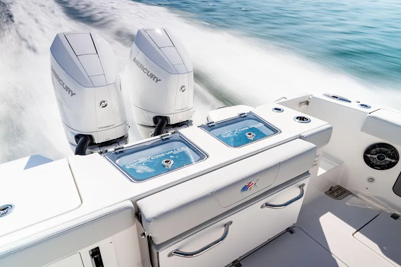 Slide: The Image of 2026 Crevalle 33 CSF boat with dual Mercury Verado engines on open water. - 4