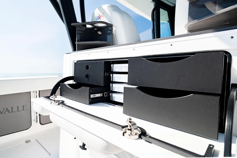 Slide: The Image of 2026 Crevalle 33 CSF boat interior with storage compartments and sleek design. - 6