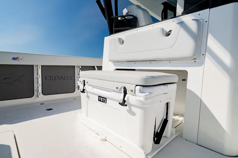 Slide: The Image of 2026 Crevalle 33 CSF boat interior with Yeti cooler and seating. - 7