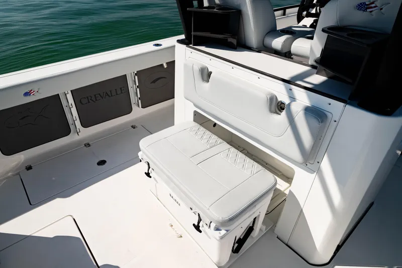 Slide: The Image of 2026 Crevalle 33 CSF boat interior with seating and storage compartments. - 8