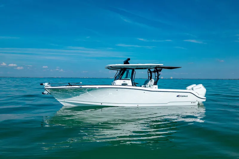 Slide: The Image of 2026 Crevalle 33 CSF boat on calm ocean waters under clear blue sky. - 9