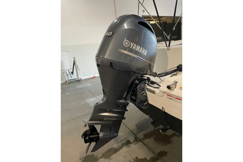 Slide: The Image of 2023 Hurricane SunDeck Sport 201 OB boat with Yamaha outboard motor, labeled "Carry On." - 11