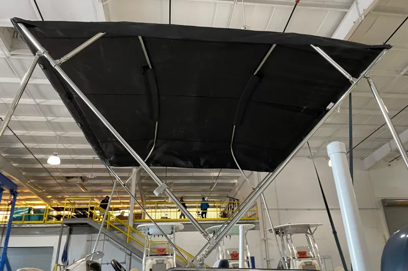 Slide: The Image of 2023 Hurricane SunDeck Sport 201 OB with Yamaha outboard motor in a marina setting. - 13