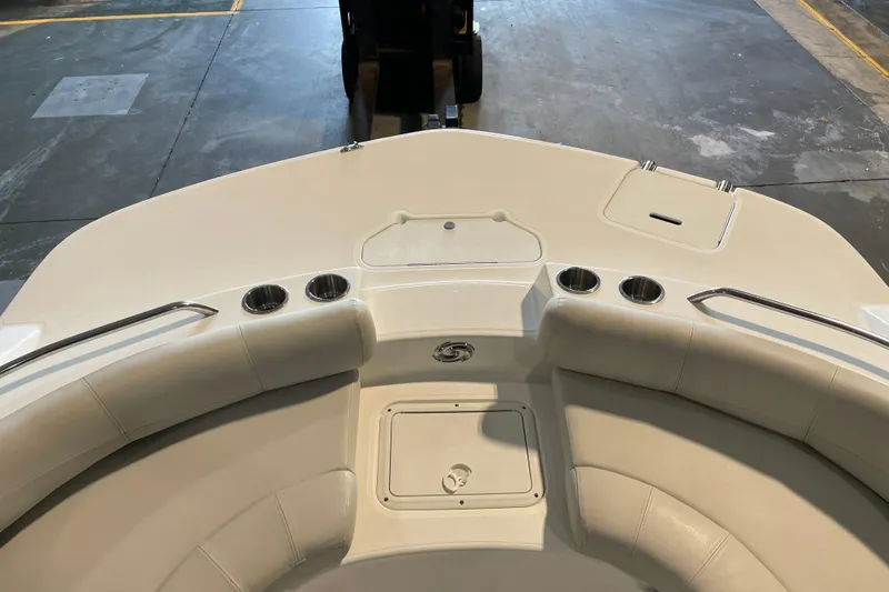 Slide: The Image of 2023 Hurricane SunDeck Sport 201 OB boat interior with beige seating and cup holders. - 15