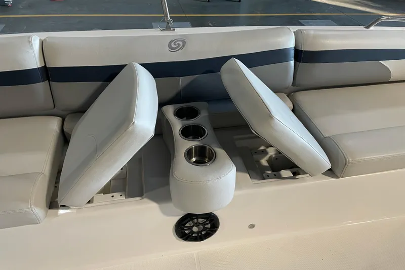 Slide: The Image of 2023 Hurricane SunDeck Sport 201 OB boat interior with beige captain's chair and steering wheel. - 21