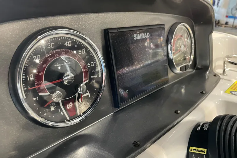 Slide: The Image of Control panel of 2023 Hurricane SunDeck Sport 201 OB boat with Fusion audio system. - 24
