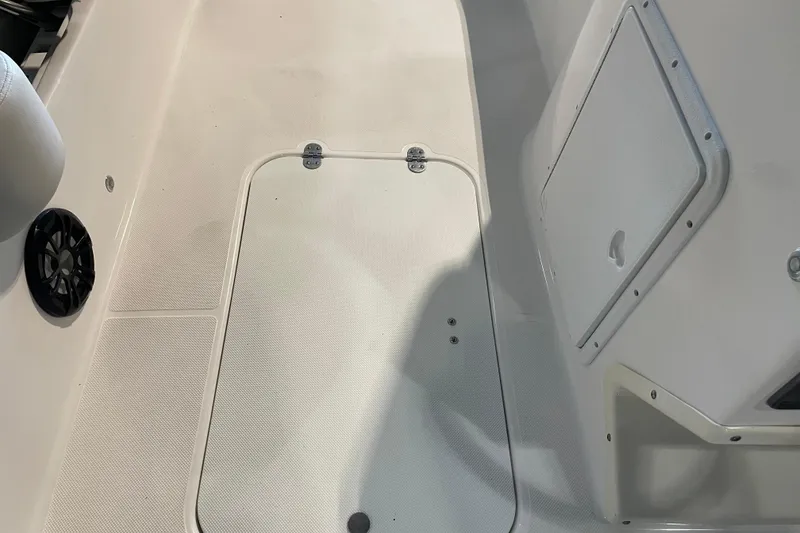 Slide: The Image of 2023 Hurricane SunDeck Sport 201 OB boat interior with seating and control panel. - 27