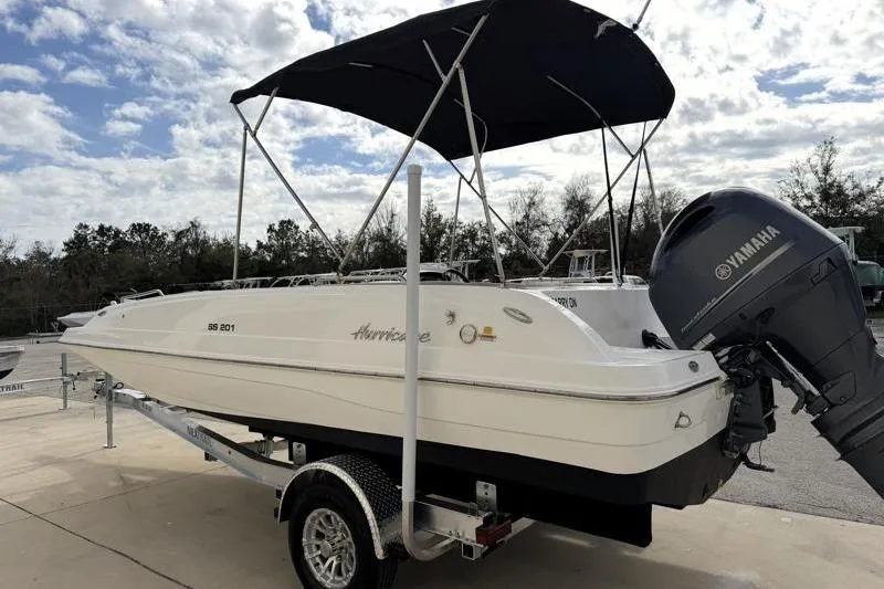 Slide: The Image of 2023 Hurricane SunDeck Sport 201 OB boat with Yamaha engine on trailer. - 33