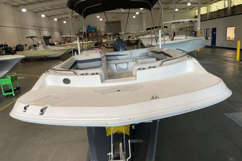 Slide: The Image of 2023 Hurricane SunDeck Sport 201 OB boat with Yamaha engine on trailer. - 5