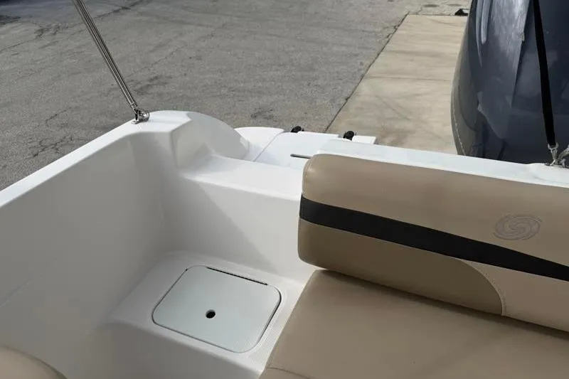 Slide: The Image of 2023 Hurricane SunDeck Sport 201 OB boat interior with beige seating and storage compartment. - 54