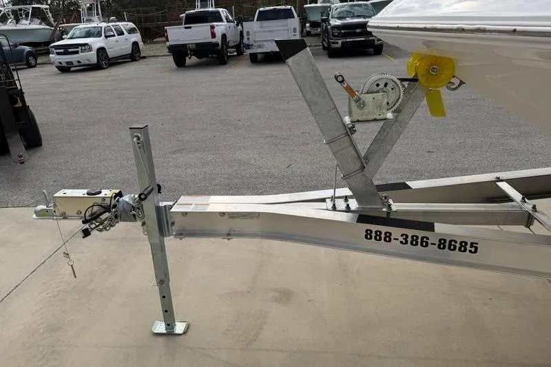 Slide: The Image of Trailer for 2023 Hurricane SunDeck Sport 201 OB boat in parking lot. - 56