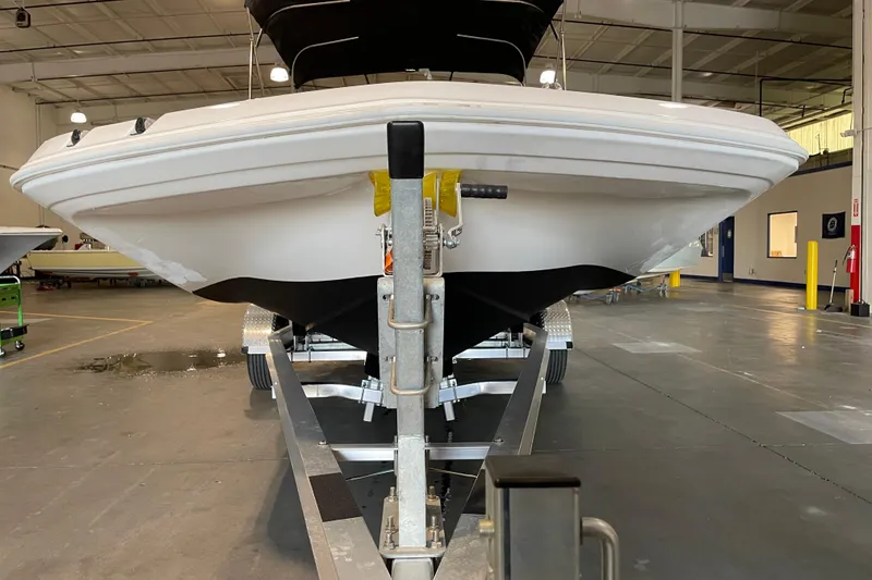 Slide: The Image of 2023 Hurricane SunDeck Sport 201 OB boat on trailer, outdoor setting. - 7