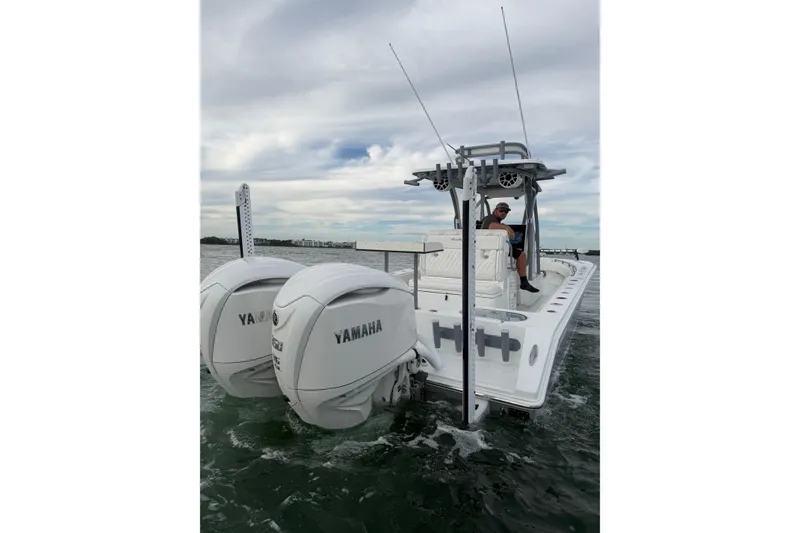 Slide: The Image of 2024 SeaHunter 28 Floridian boat with dual Yamaha engines on the water. - 12