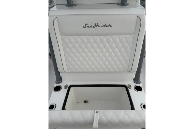 Slide: The Image of 2024 SeaHunter 28 Floridian boat seat with diamond-stitched upholstery and storage compartment. - 17