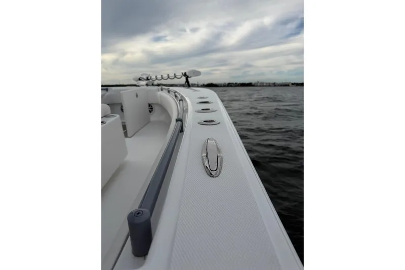 Slide: The Image of 2024 SeaHunter 28 Floridian boat on water, showcasing sleek design and modern features. - 23