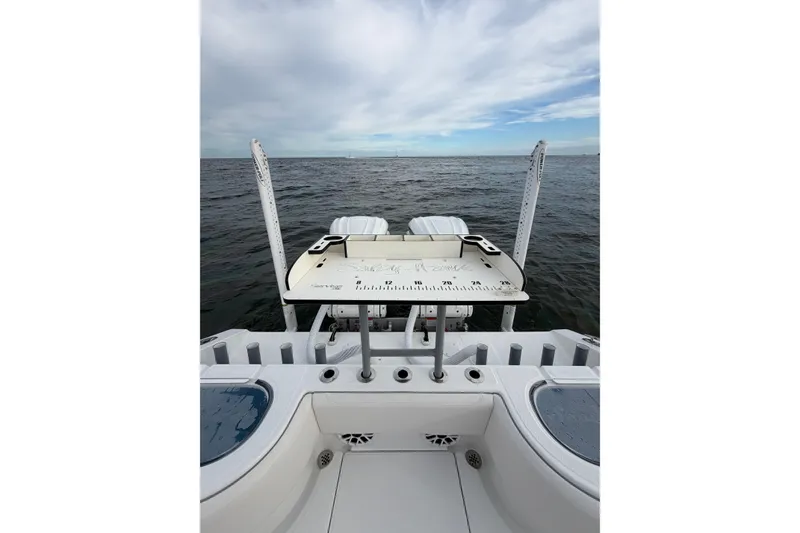 Slide: The Image of 2024 SeaHunter 28 Floridian boat with fishing platform on open water. - 25