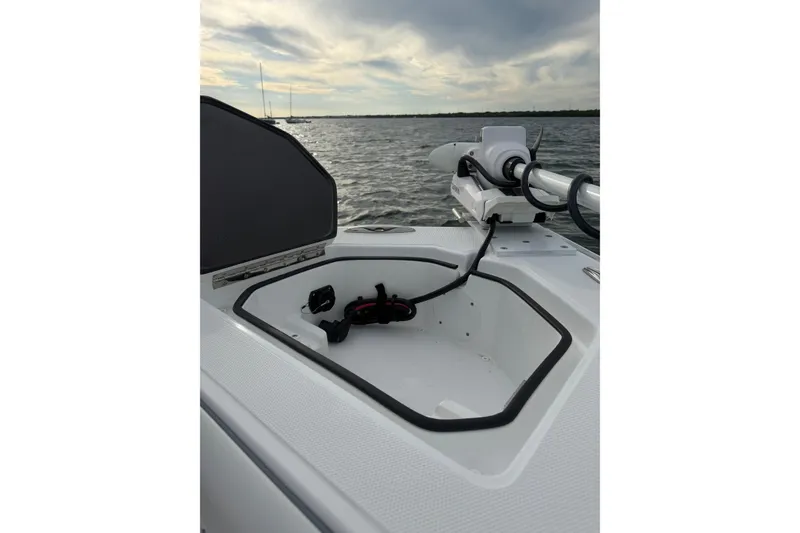 Slide: The Image of 2024 SeaHunter 28 Floridian boat with open storage compartment and mounted equipment. - 34