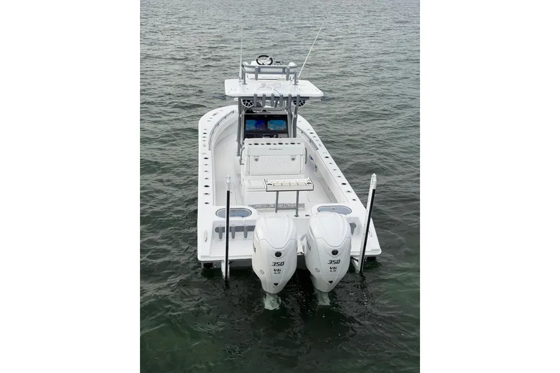 Slide: The Image of 2024 SeaHunter 28 Floridian boat with dual 350 engines on calm water. - 4