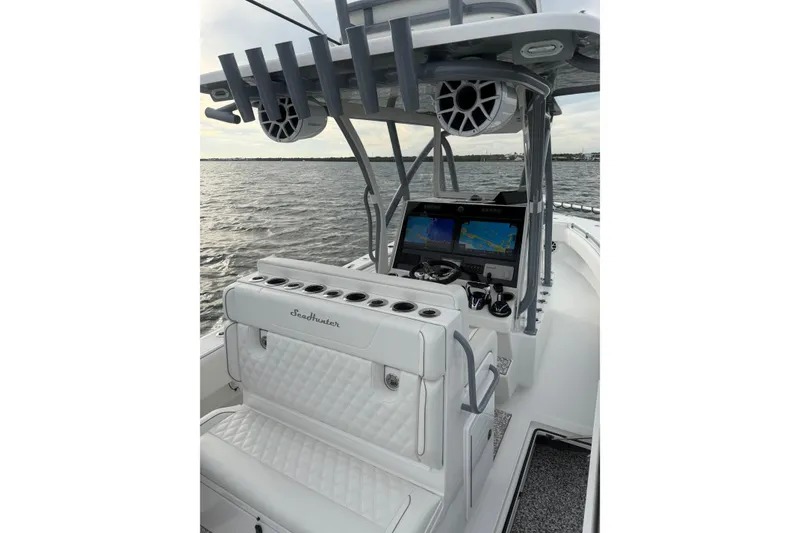 Slide: The Image of 2024 SeaHunter 28 Floridian boat interior with advanced navigation system and luxurious seating. - 40