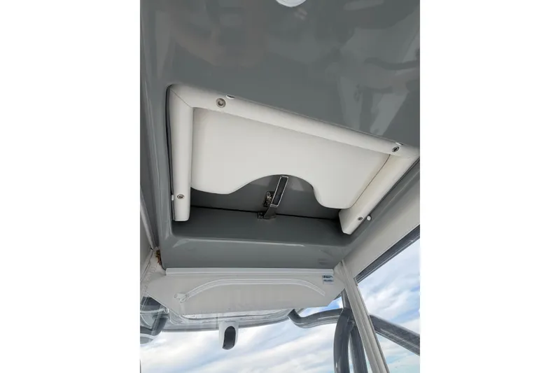 Slide: The Image of 2024 SeaHunter 28 Floridian boat interior ceiling detail with storage compartment. - 46