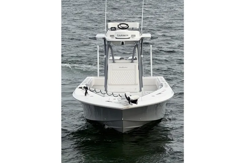 Slide: The Image of 2024 SeaHunter 28 Floridian boat on water, front view, featuring Garmin equipment. - 5