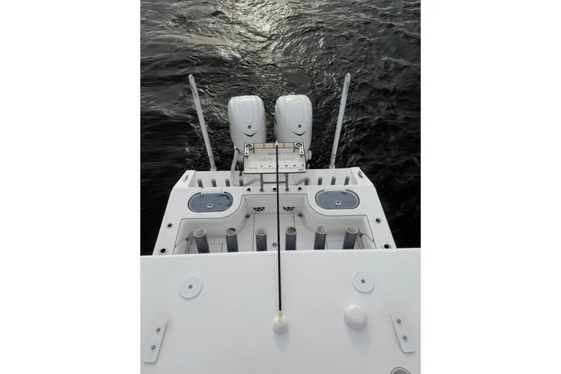 Slide: The Image of 2024 SeaHunter 28 Floridian boat with dual engines on water. - 50