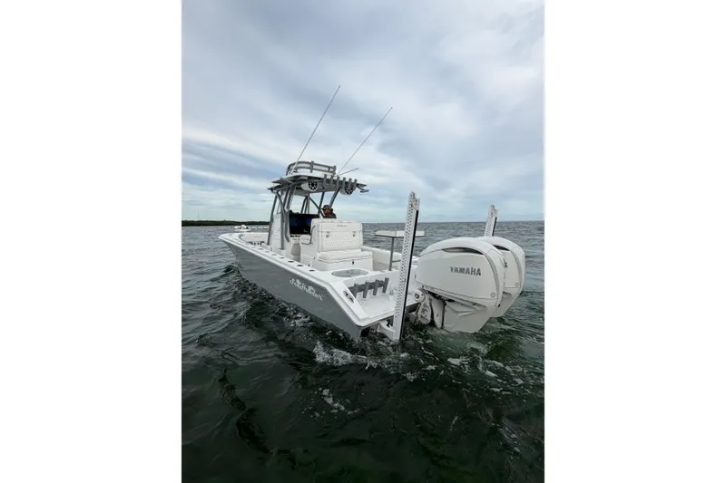Slide: The Image of 2024 SeaHunter 28 Floridian boat cruising on open water with Yamaha engine. - 7