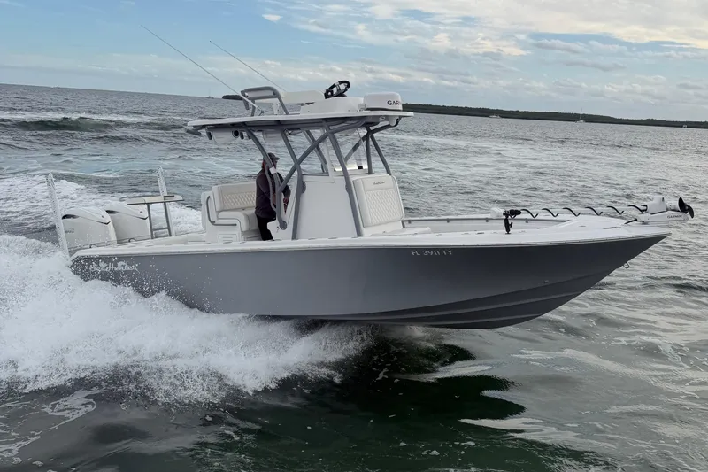 Slide: The Image of 2024 SeaHunter 28 Floridian boat cruising on ocean waves. - 9