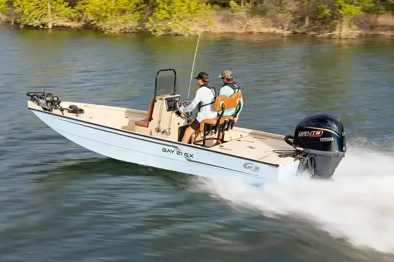 The Image of Manufacturer Provided Image: 2026 G3 Bay 21 GX boat cruising on a lake with two passengers. - 0