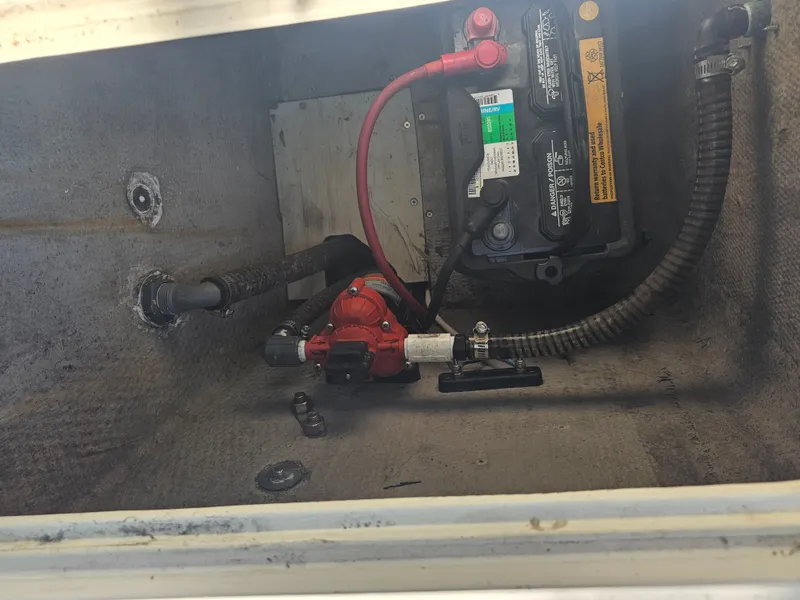 Slide: The Image of Battery and pump in a 1990 Hydra-Sports 2000 DC boat. - 12